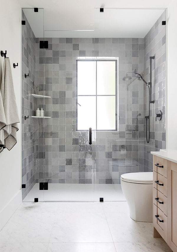walk in bathroom shower with wall tile. Design by Knight Varga Interiors | Photography by Janis Nicolay